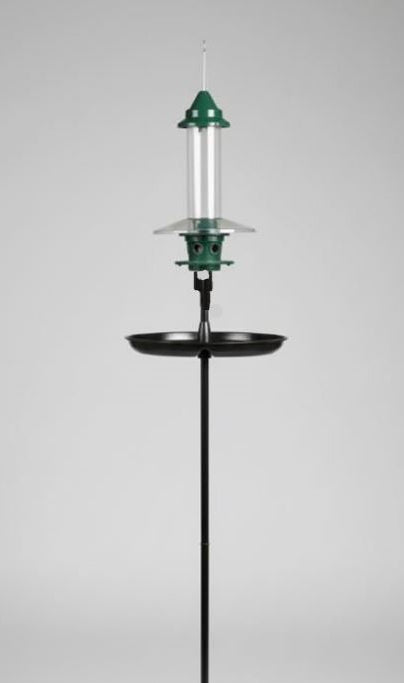 Bird feeder with green top and black stand on a gray background