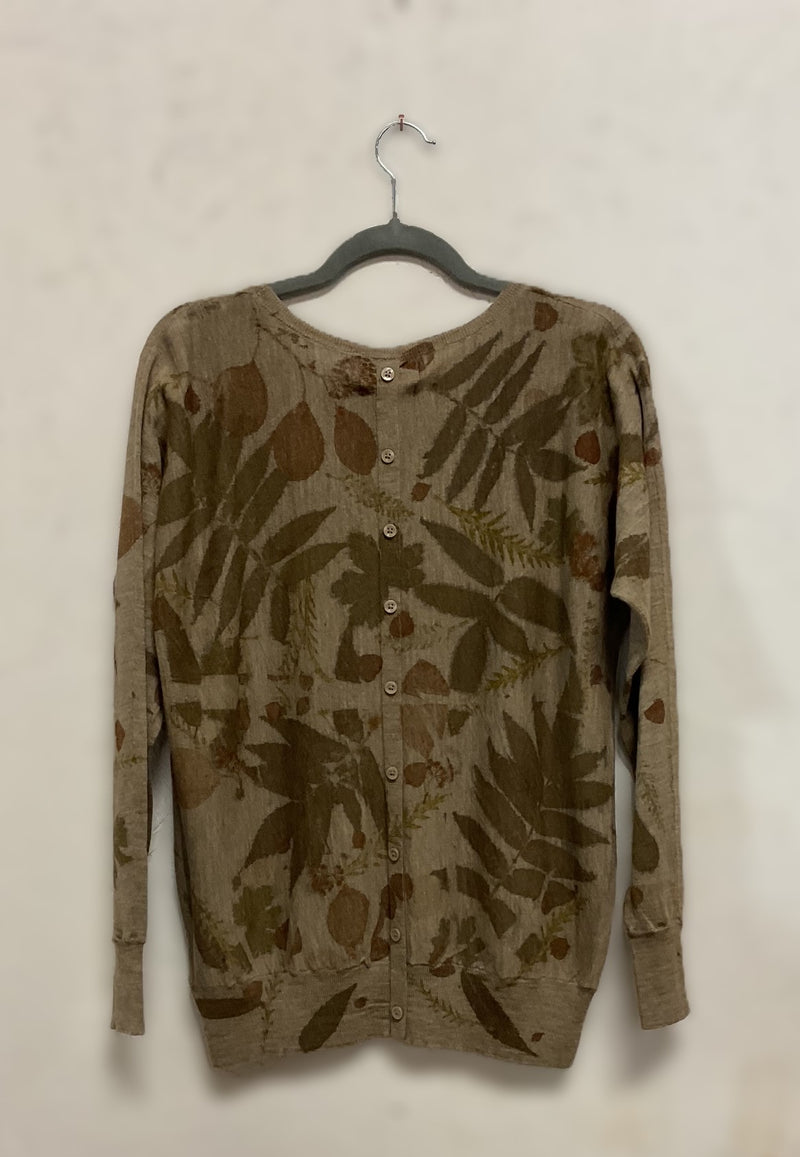Floral-patterned Merino Wool Sweater  on a hanger against a plain background - back