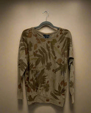 Floral-patterned Merino Wool Sweater  on a hanger against a plain background - front