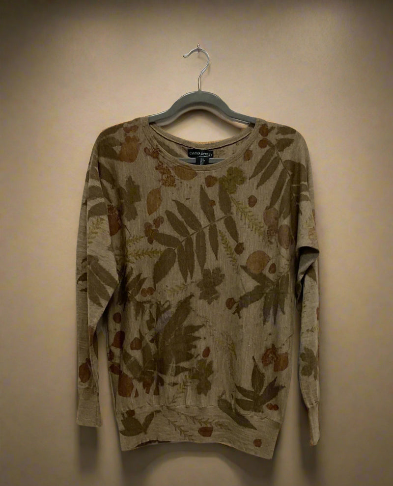 Floral-patterned Merino Wool Sweater  on a hanger against a plain background - front