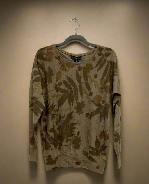Floral-patterned Merino Wool Sweater  on a hanger against a plain background - front