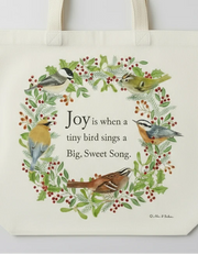 Tote bag with bird design and text on a white background - close up on design