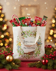 Tote bag with bird design and text on a white background surrounded by festive décor - Candy not included!