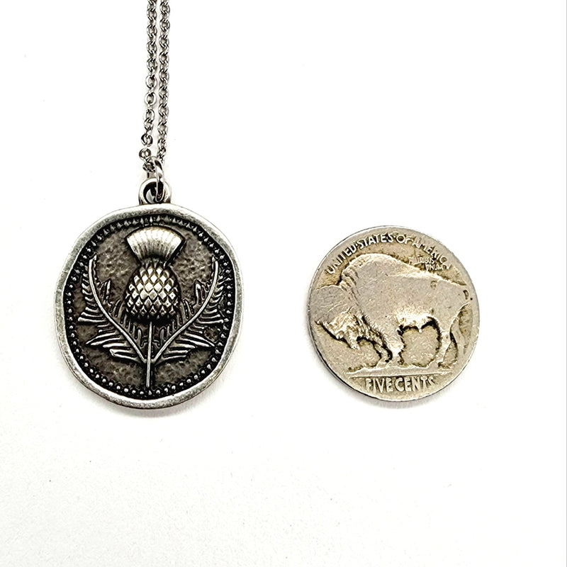 Silver pendant necklace with a buffalo nickel for comparison