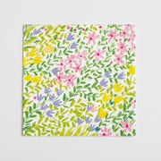 Floral patterned napkin with colorful flowers; lunch size