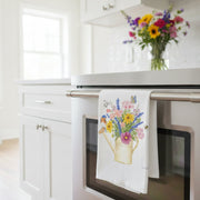 Watering Can Bluebird Bouquet Flour Sack Towel hanging on a stove handle
in a bright kitchen