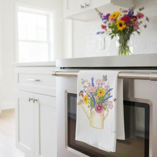 Watering Can Bluebird Bouquet Flour Sack Towel hanging on a stove handle
in a bright kitchen