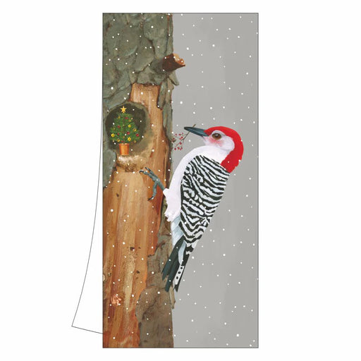 Towel with a red-bellied woodpecker on a tree trunk in a snowy scene