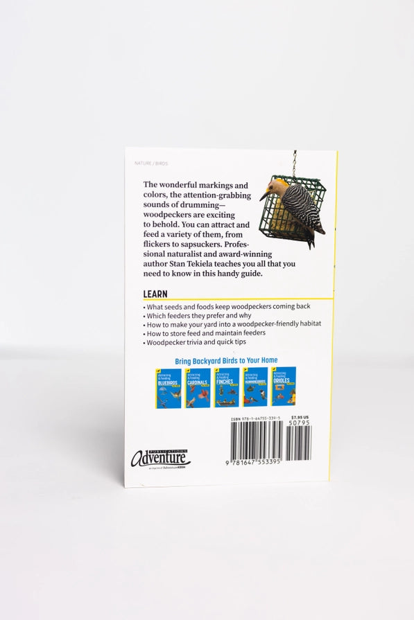 Back cover of a book with text and images of birds on a white background