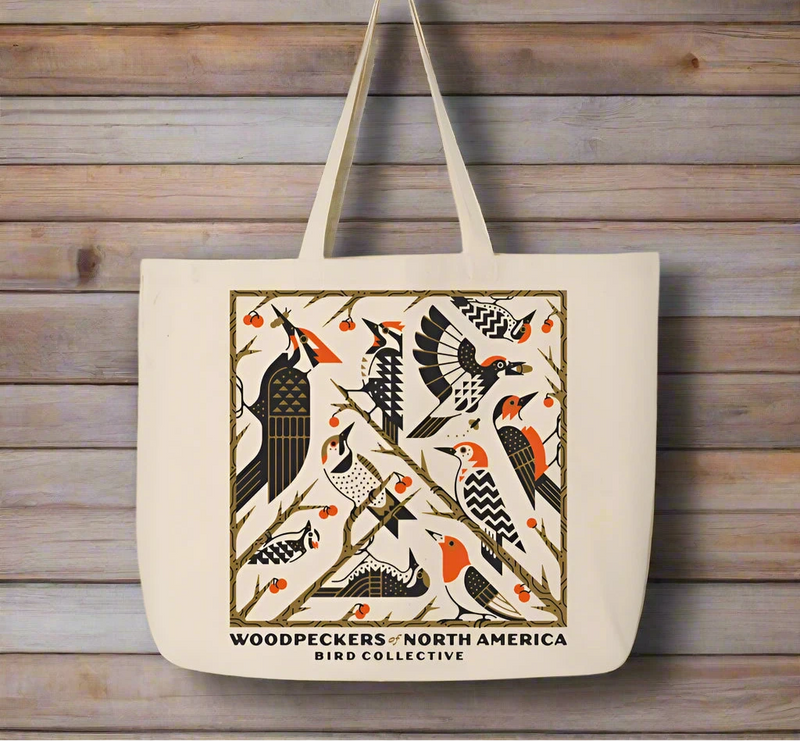 Tote bag with woodpecker design and 'Woodpeckers of North America Bird Collective' text on a white background