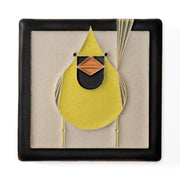 Decorative tile with a yellow cardinal design on a beige background