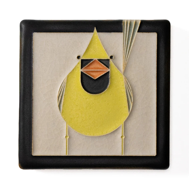 Decorative tile with a yellow cardinal design on a beige background