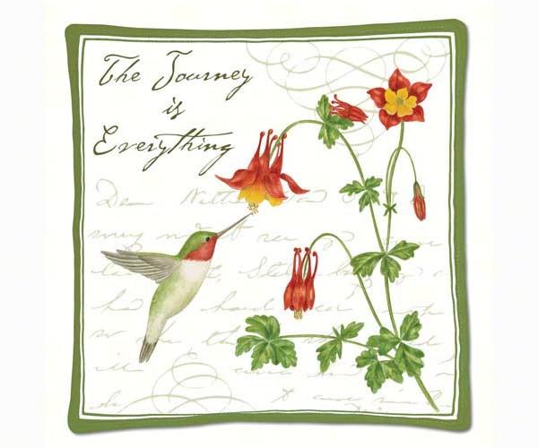 A hot pad featuring a hummingbird, flowers, and the text 'The Journey is Everything'.