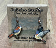 American Kestrel Earrings on cardboard
