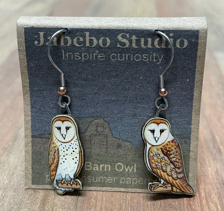Barn Owl Earrings on cardboard