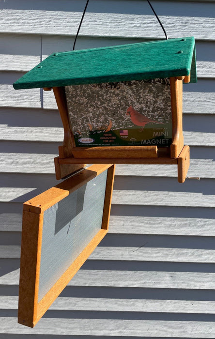 Mini Magnet Hanging Recycled Feeder in tan with green roof showing pivoting tray for cleanout
