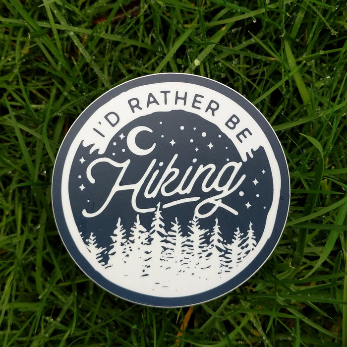 I'd Rather Be Hiking Sticker in grass