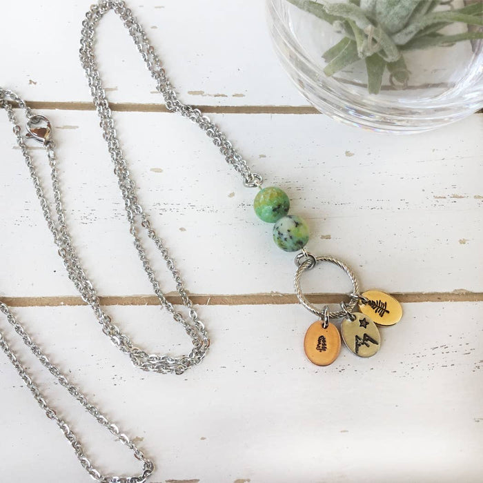 Mixed metal forest charm necklace with extra long chain