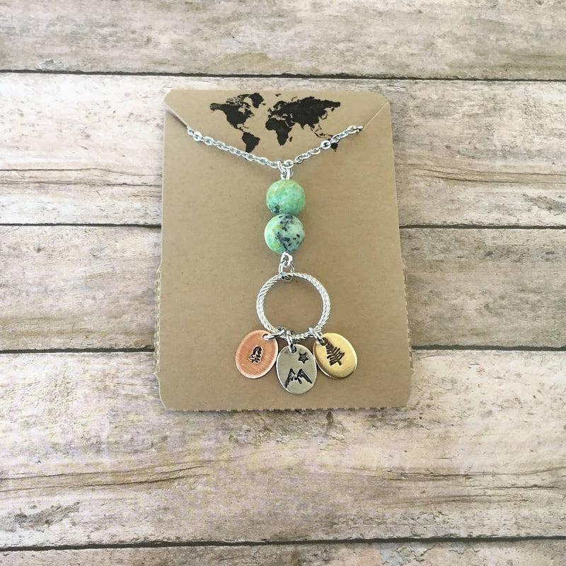 Mixed metal forest charm necklace with extra long chain with packaging