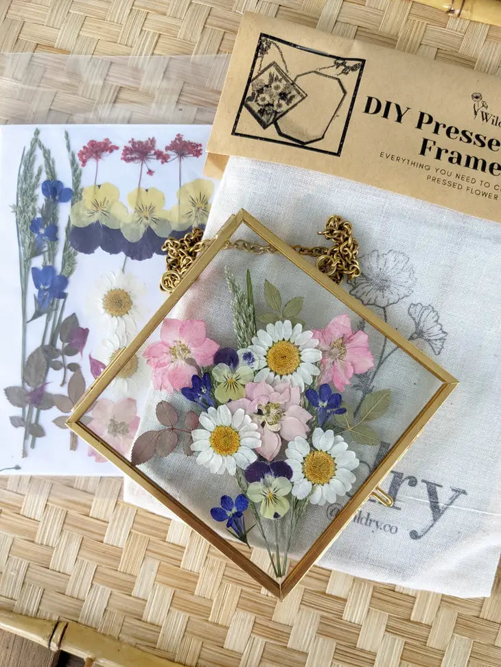 A handmade cottage: Pressed wild flowers in glass frames