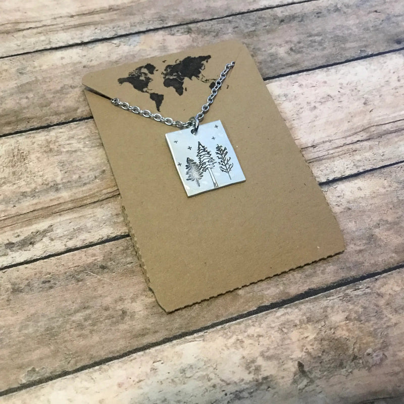 Forest at Night Rectangular Pendant in Silver Color with packaging