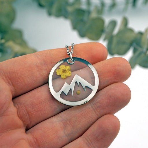 Mountain Mustard Seed Necklace in hand