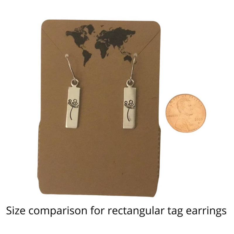 Size comparison of rectangular tag earrings to penny