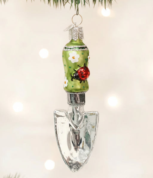 Ornament of garden trowel with lady bug on handle